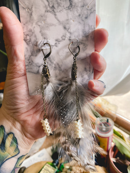 Feather & Rattlesnake Vertebrae Brass earrings